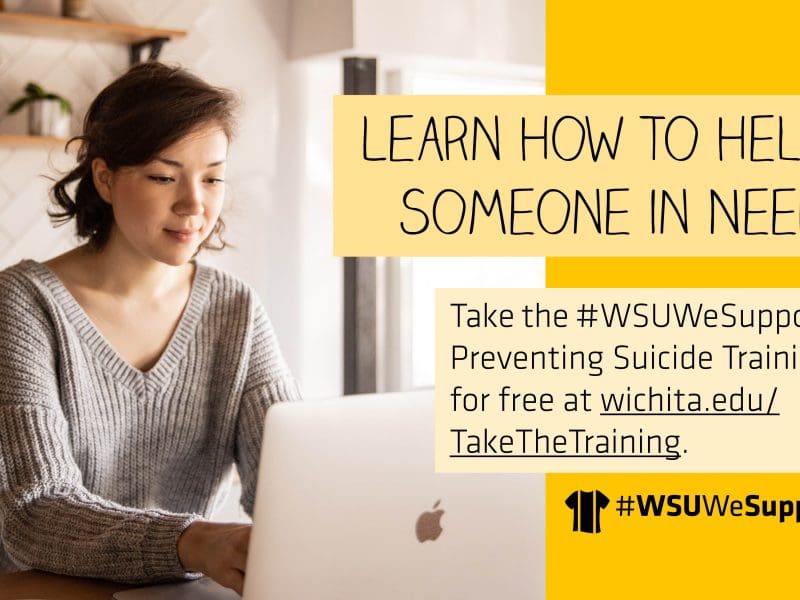 A light-skinned woman with dark hair wearing a sweater and using a Macbook. The right side of the image reads: "Learn how to help someone in need. Take the #WSUWeSupportU Preventing Suicide Training for free at wichita.edu/TakeTheTraining." The #WSUWeSupportU t-shirt logo is at the bottom.