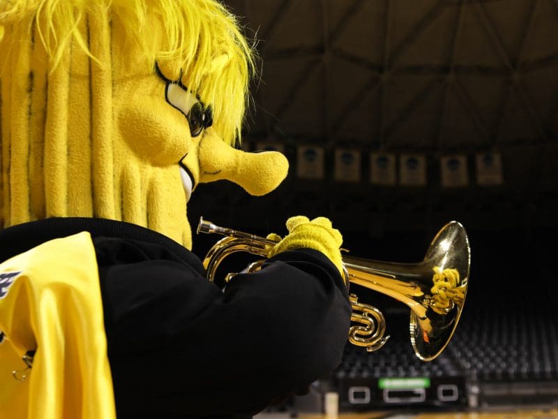 Picture of Wu playing trumpet.