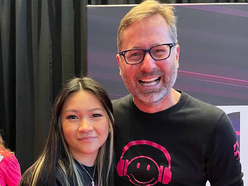 (Left to right) Picture of Wichita State University senior Truc Nguyen and T-Mobile for Business CEO Mike Sievert.