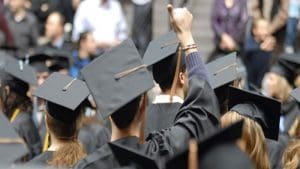 Picture of students from behind at graduation.