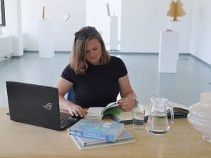 Picture of Dr. Eva Gartnerová, at her desk.