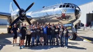 WSU Alumni Association and Industry and Defense Programs staff pose with Doc at the first Pull-a-Plane event.