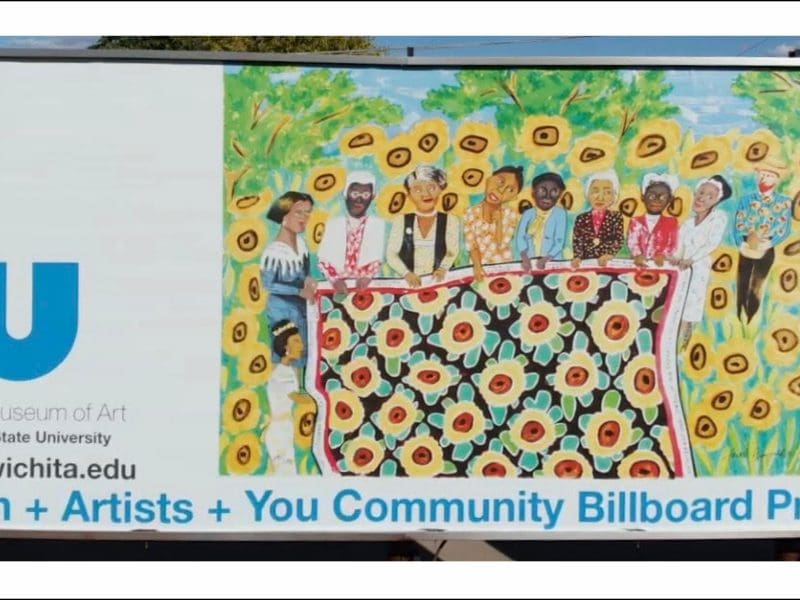 A photo of the Ulrich billboard featuring artist Faith Ringgold's "Sunflower Quilting Bee at Arles" (1996), which was located at 1400 E. Harry in Wichita.