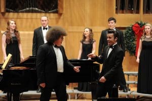 Two members of the madrigal singers perform in a past candlelight concert.