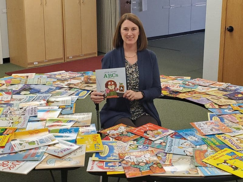 Picture of Melissa Vagts with donated books.