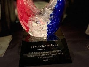 Red, clear, and blue abstract glass trophy.