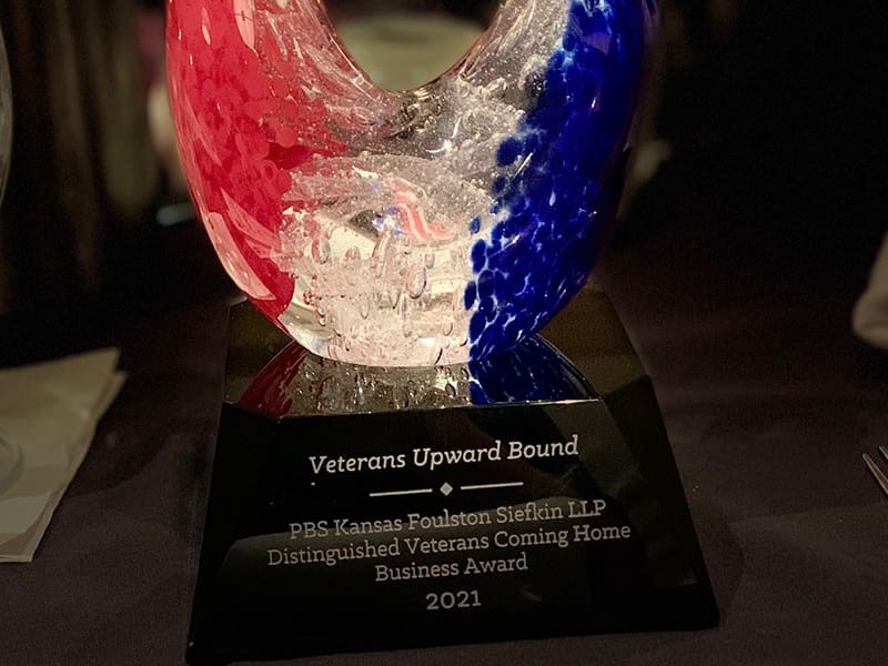 Red, clear, and blue abstract glass trophy.