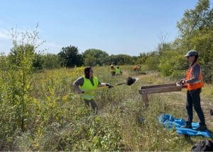 Wichita State archaeology students dig and sift through dirt that they excavated at North Chisolm Creek Park in Wichita. The dig was part of a cultural survey to ensure that no ancient artifacts would be destroyed when the city made infrastructure changes to the park.