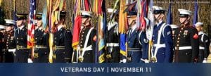 Image featuring service members during parade and text 'Veterans Day, November 11.'