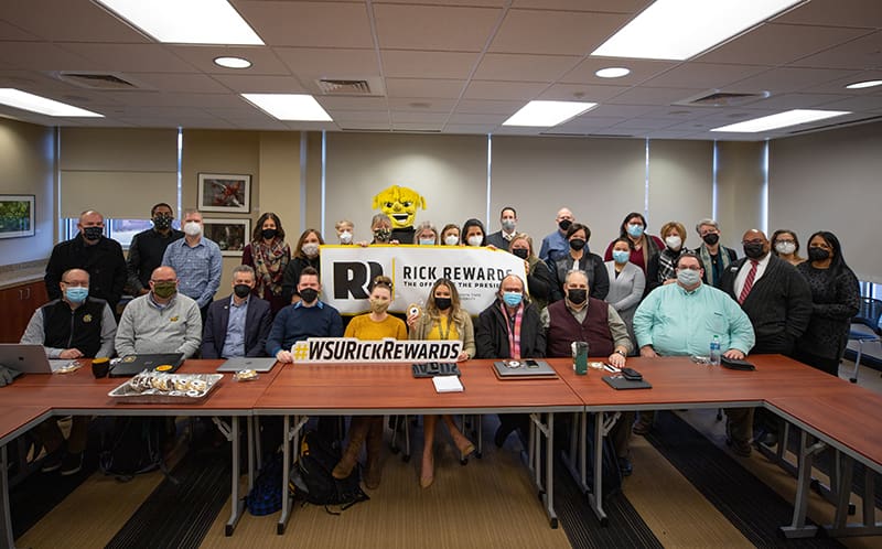 Photo of President Rick Muma visiting The Strategic Enrollment Management (SEM).