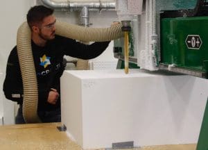 Picture of Wichita State student Jackson Penner works at GoCreate on the Promise Bridge support project.