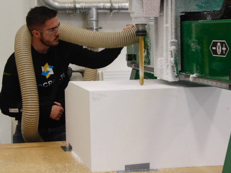 Picture of Wichita State student Jackson Penner works at GoCreate on the Promise Bridge support project.