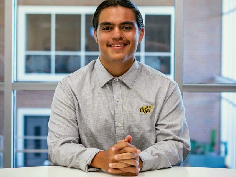 Picture of seated Nicolas Reyes.