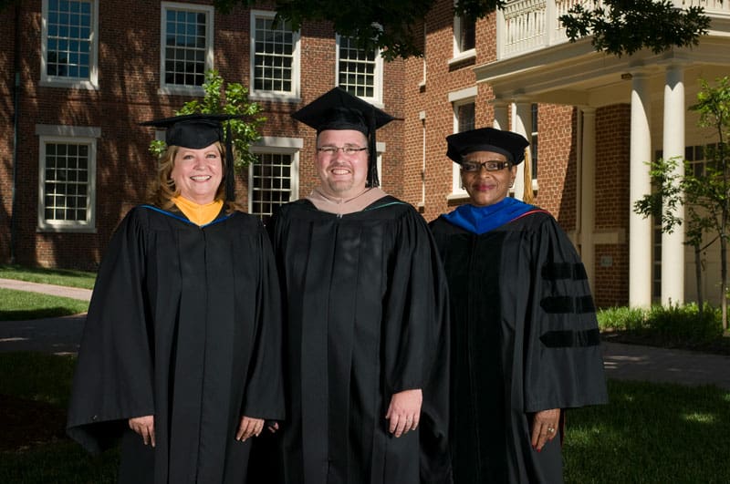 (image of faculty/staff in regalia)