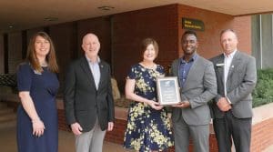 Image of Credit Union of America representatives Lea Ann Gabbert, Kym Money and Bradley Dyer.