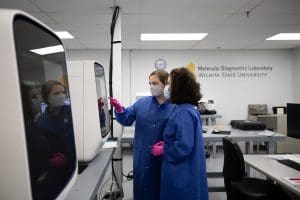 Image of two members working in lab at MDL.