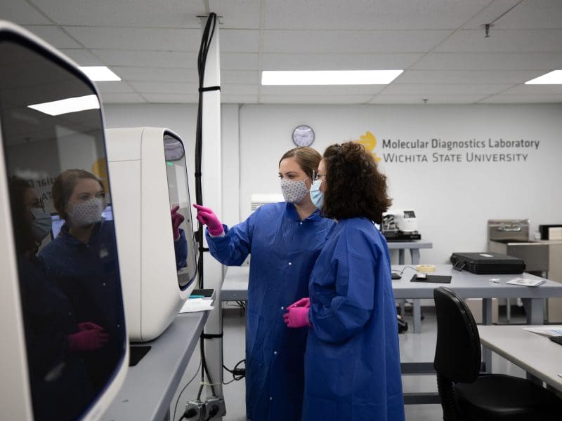 Image of two members working in lab at MDL.