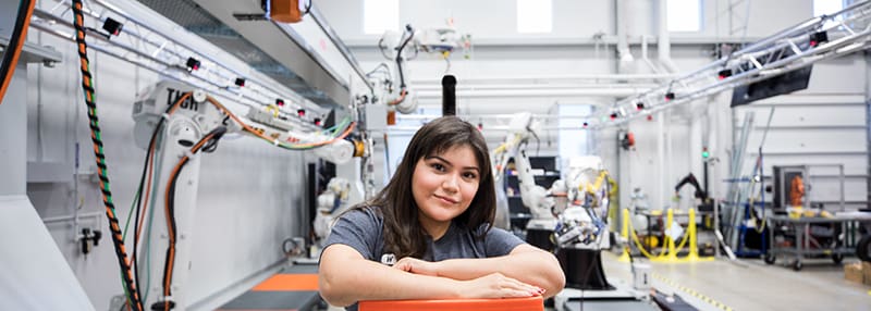 Image of female WSU Student working at lab.