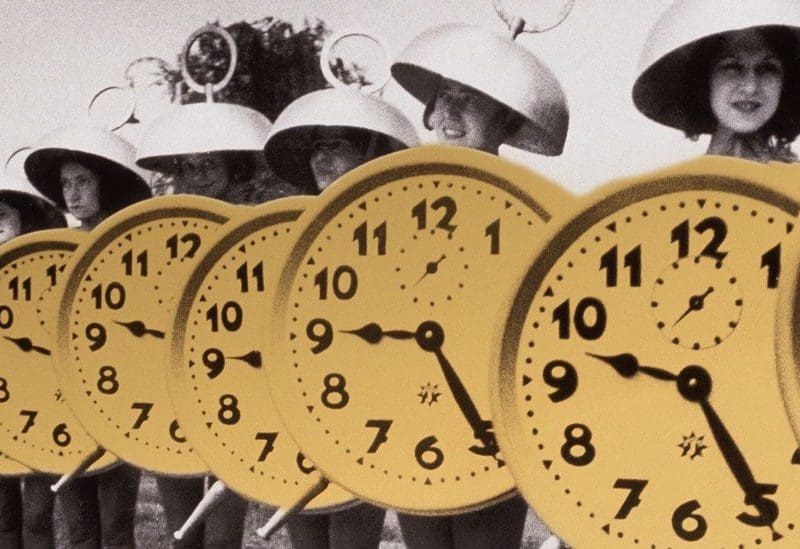 Image of people dressed up in alarm clock costumes.