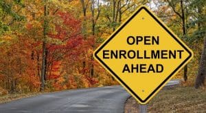 Image of road sign on country road reading Open Enrollment ahead.