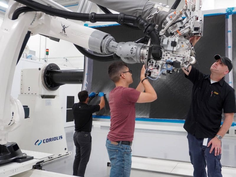 Image of three members working on manufacturing at NIAR.