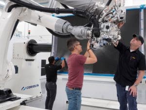 Image of three members working on manufacturing at NIAR.