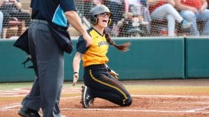 Image of Sydney McKinney slding into home.