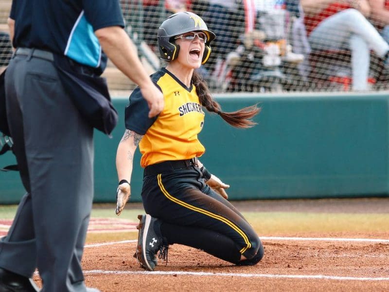 Image of Sydney McKinney slding into home.