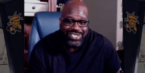 Image of Shaquille O'Neal sitting in chair