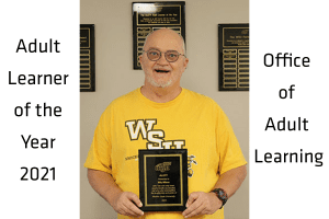 The ALOTYS 2021 award recipient holding his award plaque.