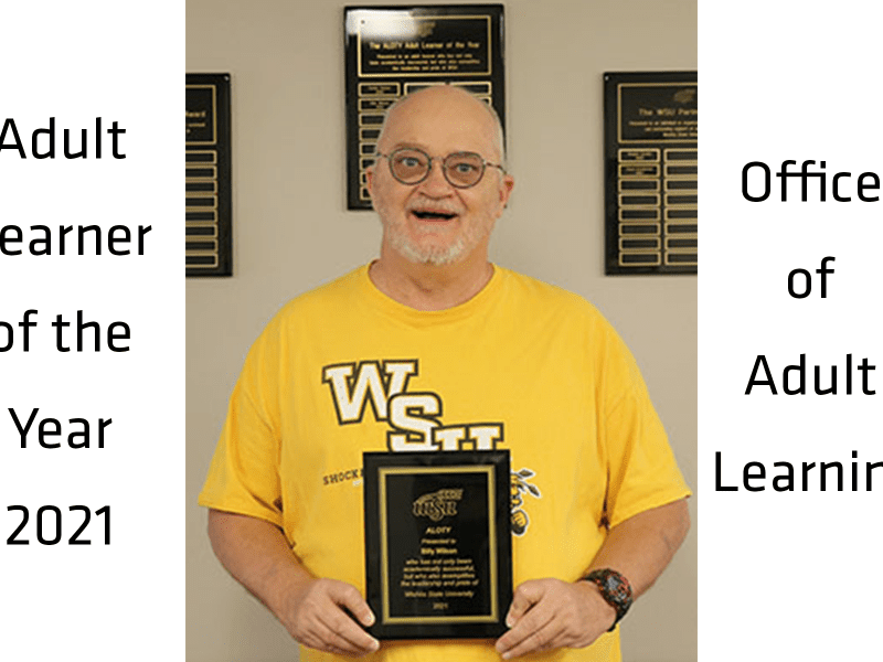The ALOTYS 2021 award recipient holding his award plaque.