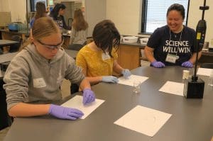 Image of students wokring at table at Expanding Horizons Workshop.