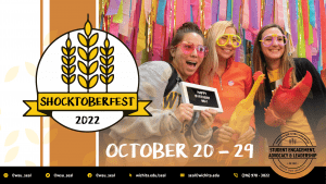 Image of three students holding plaque and psoing for photo. SEAl Logo and text Oct. 20-29.