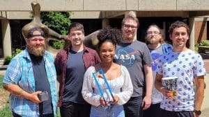 Wichita State students and staff working on the grant project, “Cube-sat Space Flight Test of a Neutrino Detector,” include (from left) Jarred Novak, Trent English, Ayshea Banes, Jonathan Folkerts, Brian Doty and Octavio Pacheco. Novak, English and Folkerts traveled to Paris this fall to present their work on the project.