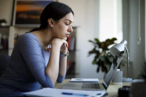 Woman sitting at laptop