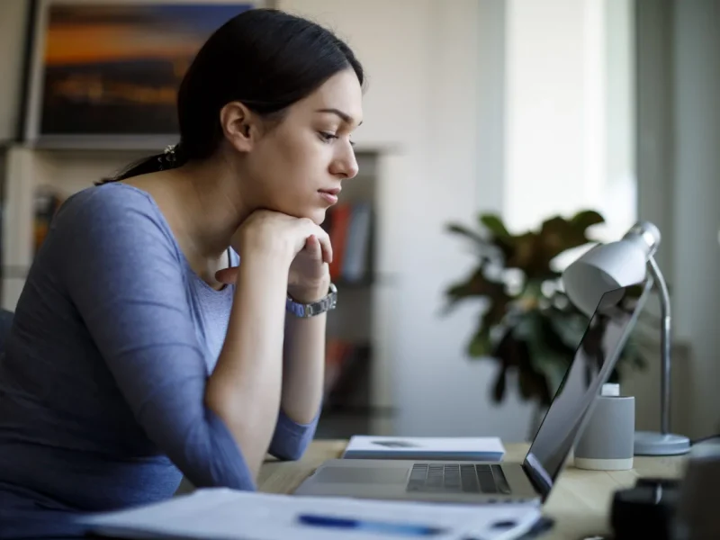 Woman sitting at laptop
