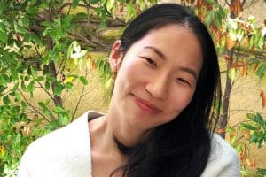 Photo of Cindy Juyoung posing in a spring setting.