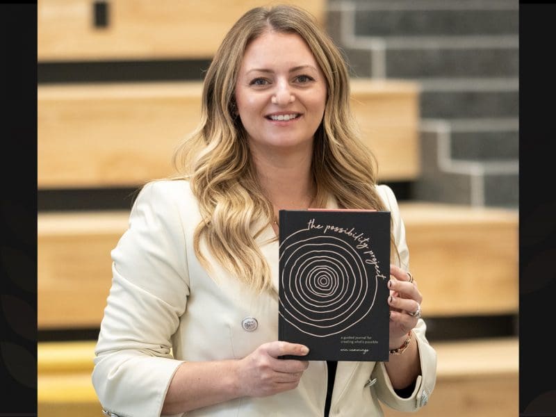Photo of Erin Cummings with her new book in Woolsey Hall.