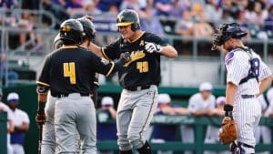 Photo of Shocker baseball players celebrating during the game against Kansas State University.