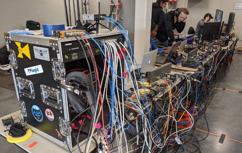 A photo of students and staff at the Media Resources Center working on a livestream.