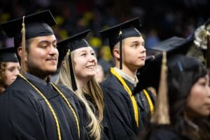 Photo of students in their regalia at the fall 2022 commencement ceremony.