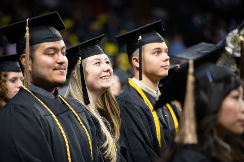 Photo of students in their regalia at the fall 2022 commencement ceremony.