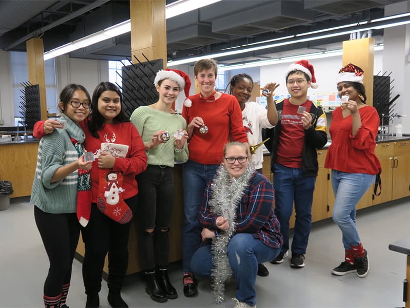 Moriah Beck poses with her students during the holidays