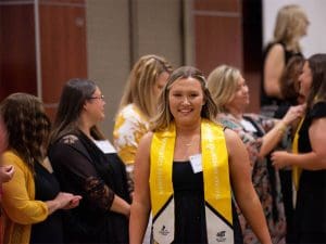 A student in the Teacher Apprentice Program being recognized