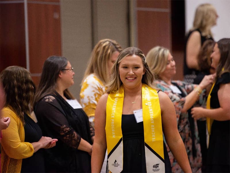 A student in the Teacher Apprentice Program being recognized