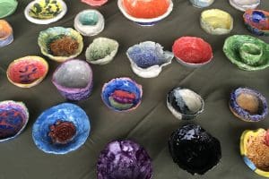 A variety of bowls are pictured in an array of colors.