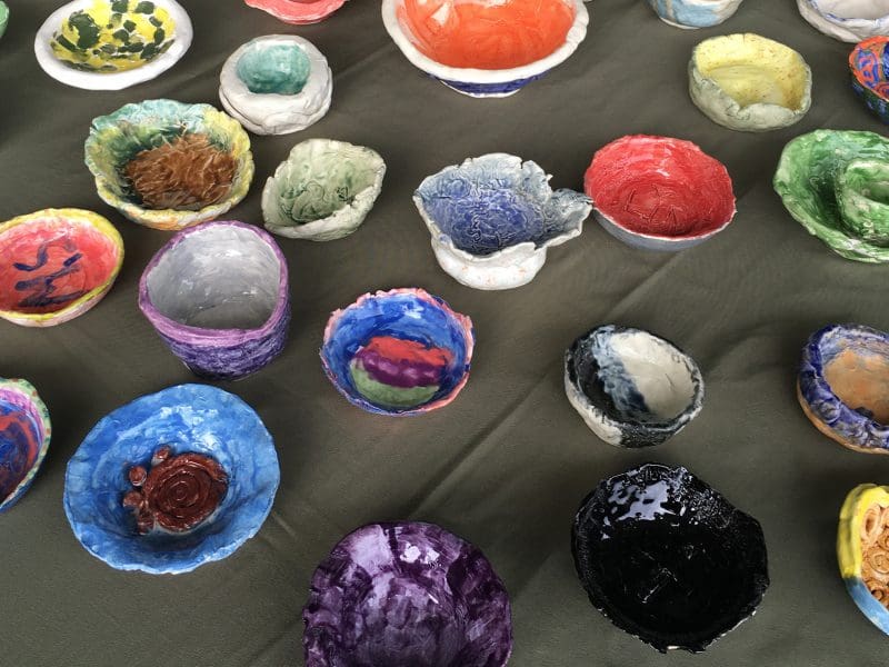 A variety of bowls are pictured in an array of colors.
