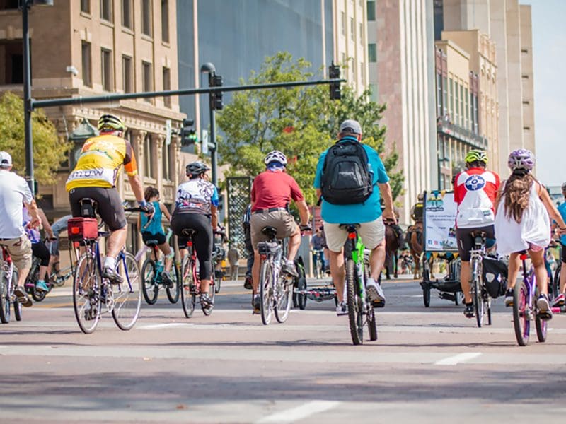 A group of bicyclers ride down Douglas Avenue.