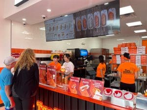 Employees at Two Hands take orders from customers