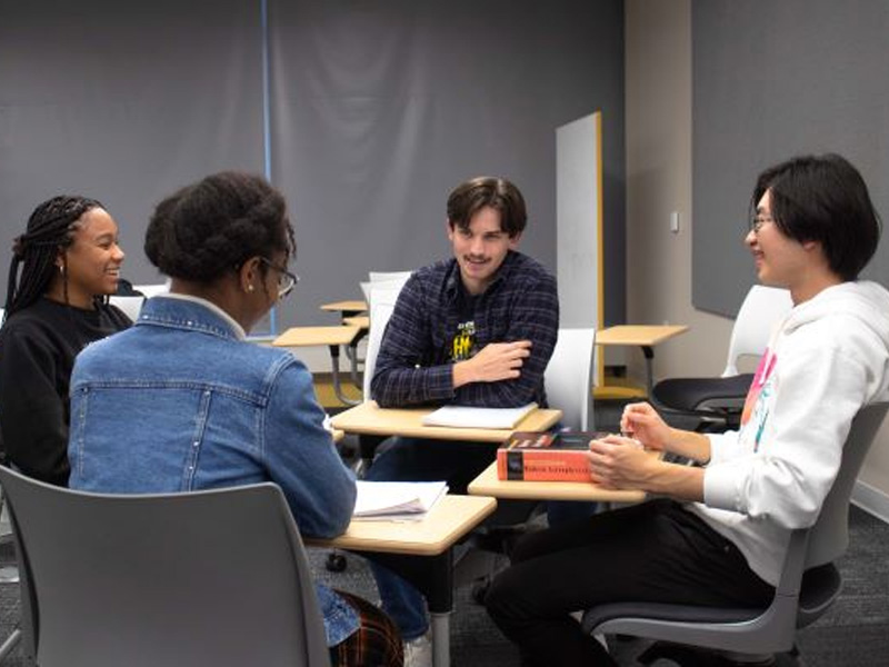 A group of students mingling as they study